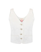 Close do tecido denim e botões da blusa colete Alcance