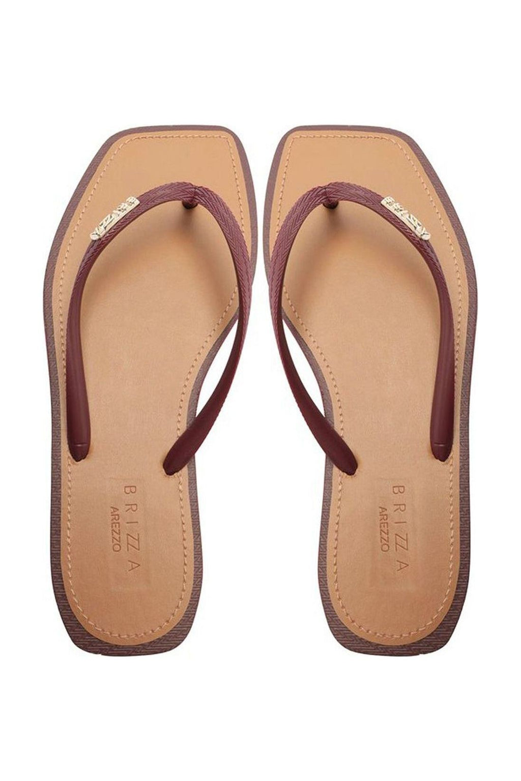 Chinelo de dedo Brizza vermelho com tira fina e placa dourada, par visto de cima sobre fundo bege