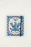 Planner Bem Vindo Ao Paraíso Farm Etc azul com capa ilustrada de arara, abacaxis e flores e elástico de fechamento